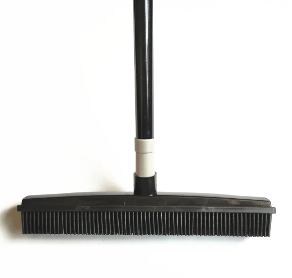 Pet hair removal broom with rubber bristles and black handle