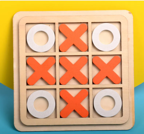Wooden tic-tac-toe board game with orange X and white O pieces, front view