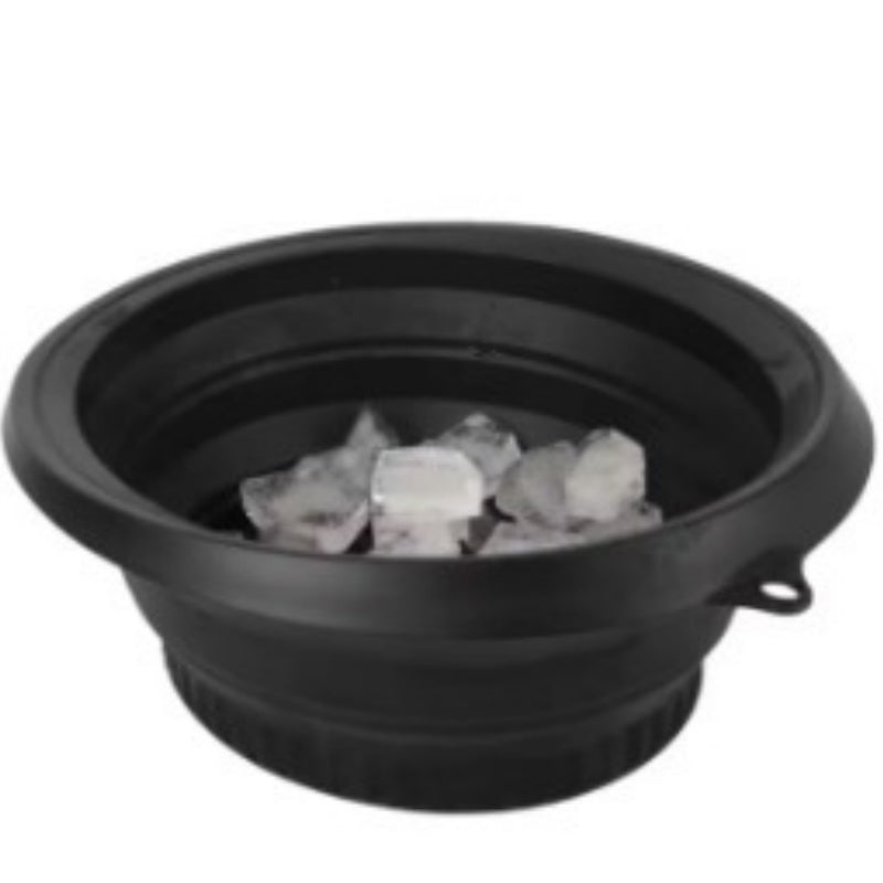 Black collapsible silicone ice basin filled with ice cubes, front view