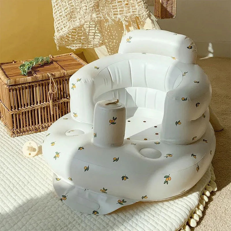 Bear print inflatable baby chair in a sunny room by a wicker basket