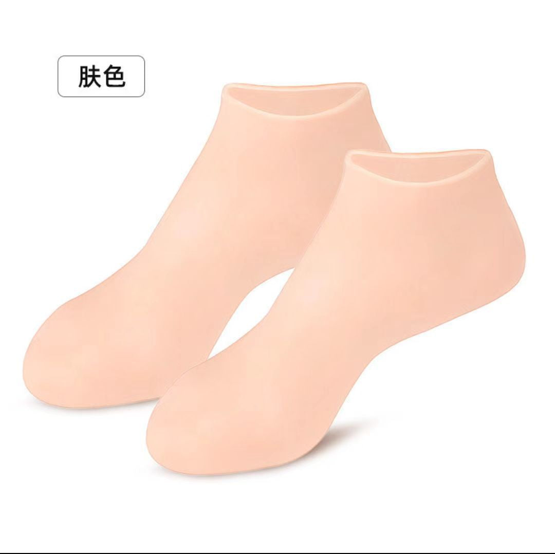 Pair of nude silicone moisturizing socks