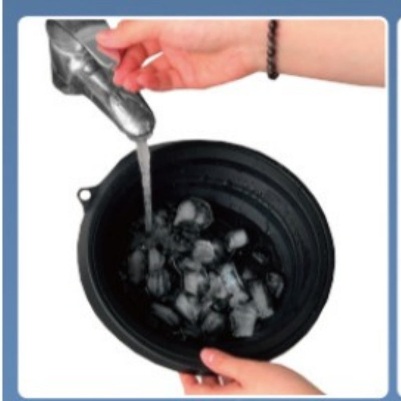 Hands adding water to ice in a black collapsible silicone ice basin