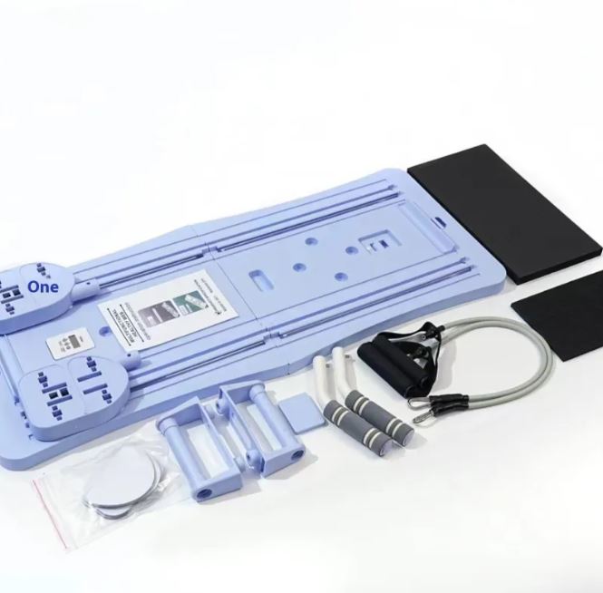 Blue compact Pilates board with resistance bands, mat and accessories