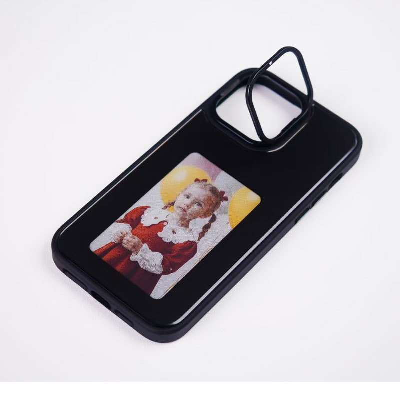 Black NFC display phone case lying flat with a fold-out ring stand, full view