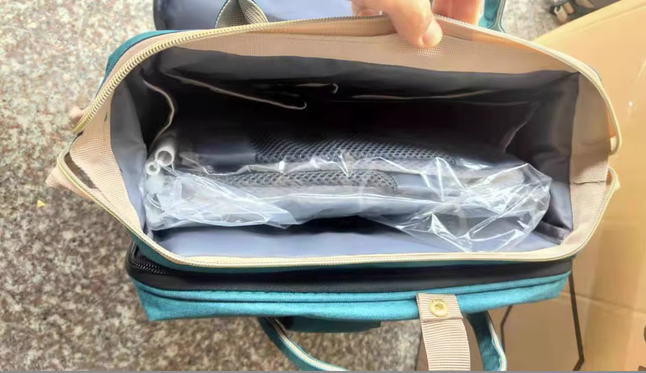 Inside the mommy bag's main compartment in its packaging