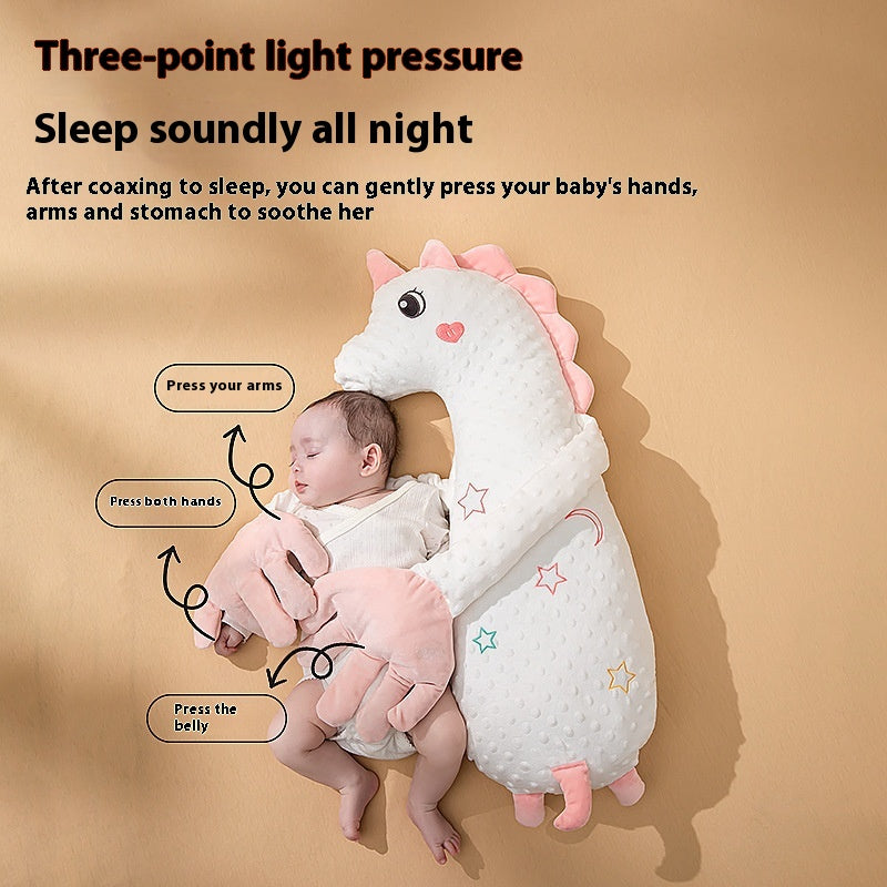 Unicorn baby pillow with labels showing light pressure soothing points
