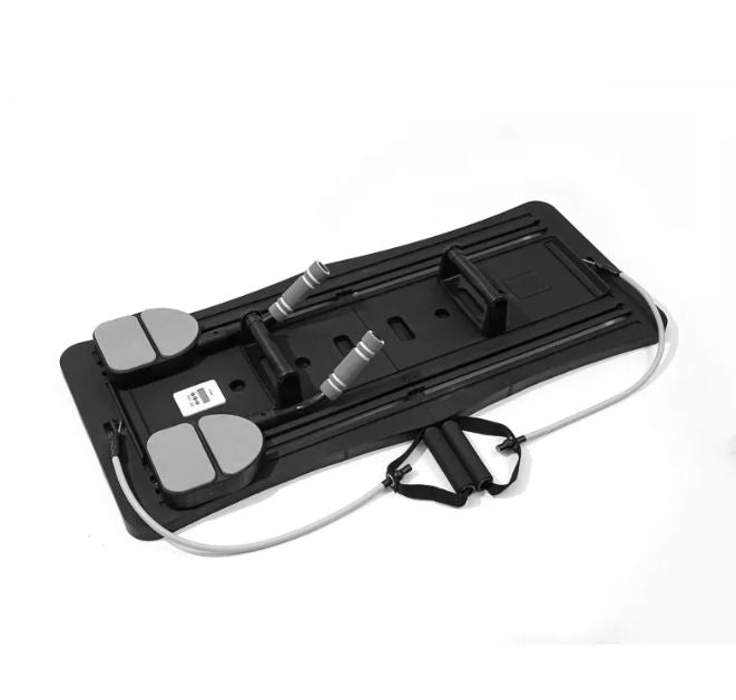 Black Pilates sliding board with foot pads and handle bands