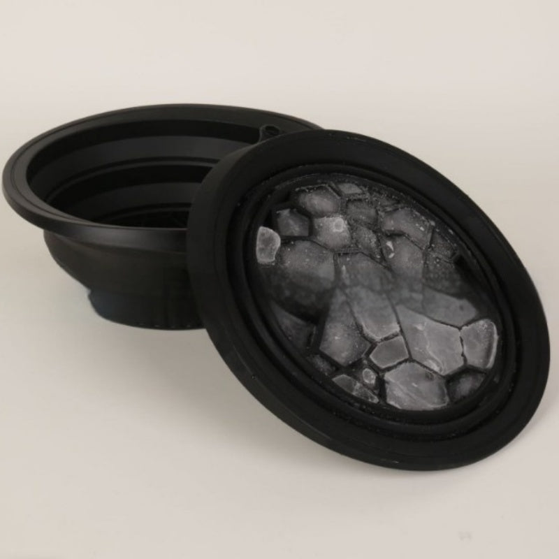 Two black collapsible silicone ice basins, one with ice