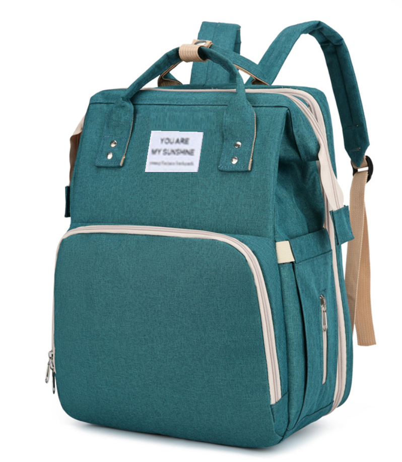 Teal mommy backpack shown at an angle with side pocket