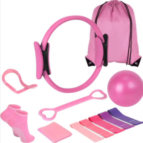 Pink 13-piece yoga and Pilates set: ring, ball, bands, socks and bag shown upright