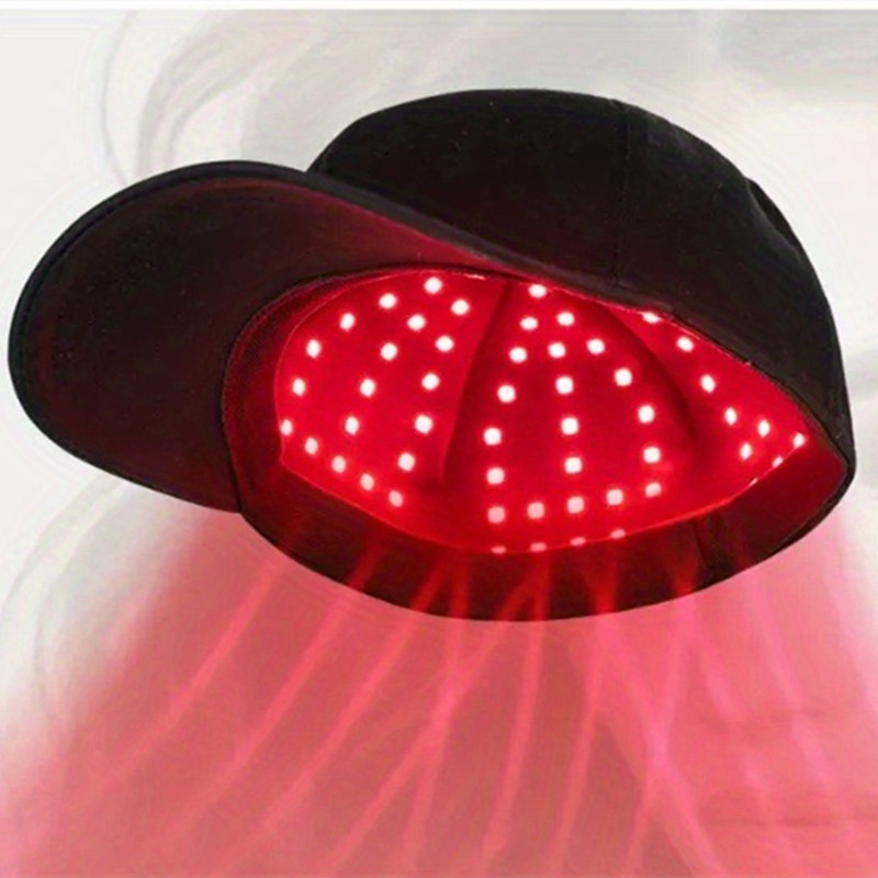 Glowing red LEDs inside a red light therapy cap