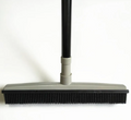 Pet hair removal broom with rubber bristles and gray handle, front view
