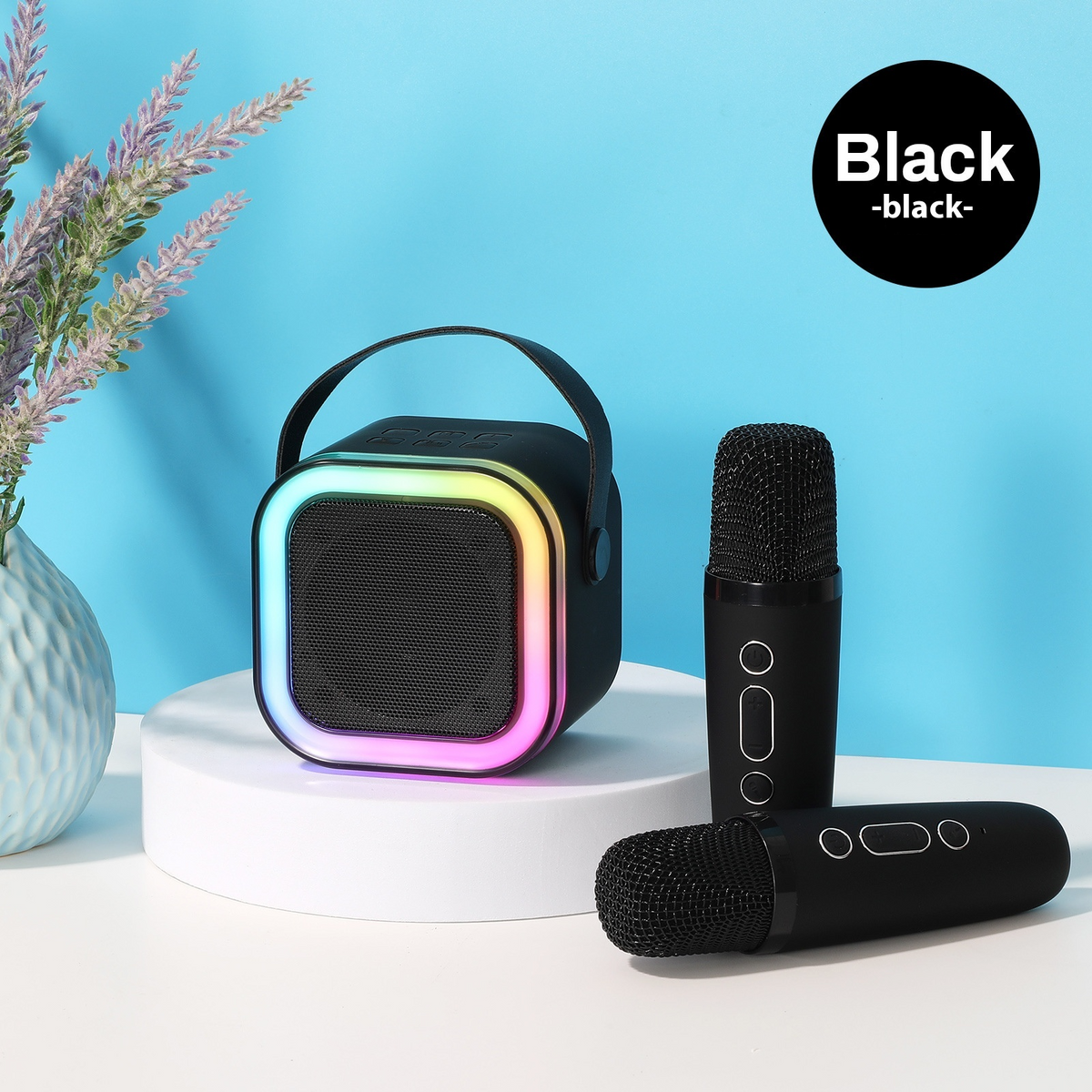Black mini Bluetooth karaoke speaker with RGB light ring and microphone shown upright