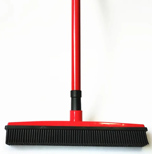 Pet hair removal broom with rubber bristles and red handle, front view