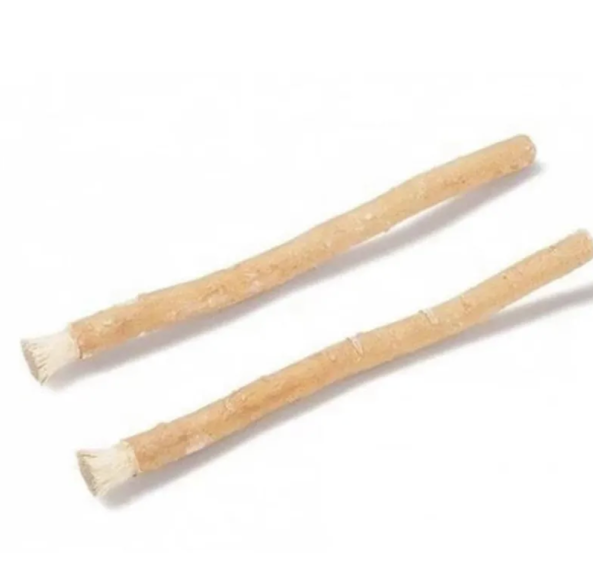 Two unwrapped miswak tooth cleaning sticks