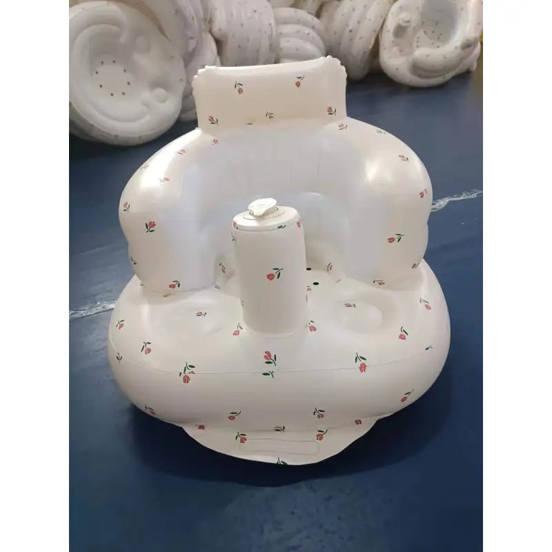 White inflatable baby chair with bear print and front cup holder, front view