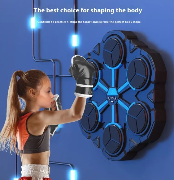 Woman in boxing gloves training on a wall-mounted boxing target machine