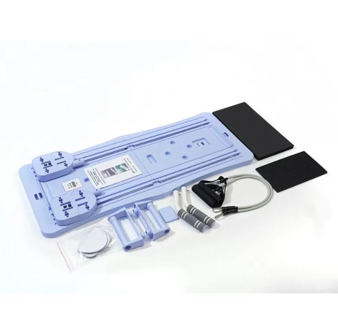 Blue compact Pilates board with resistance bands, mat and accessories shown upright
