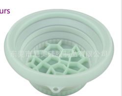 Mint green collapsible silicone ice basin showing its textured base